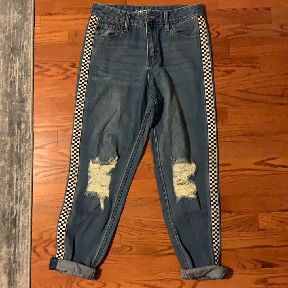 blue ripped mom jeans with checkered pattern on both legs